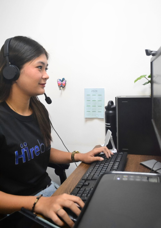 A medical virtual assistant from Hirebiz Med working from an office